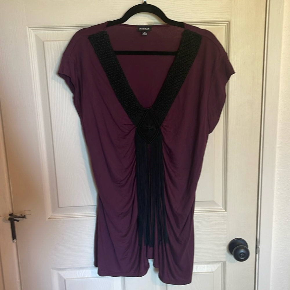 Allen B. Size XL. Hanging fringe on front.
